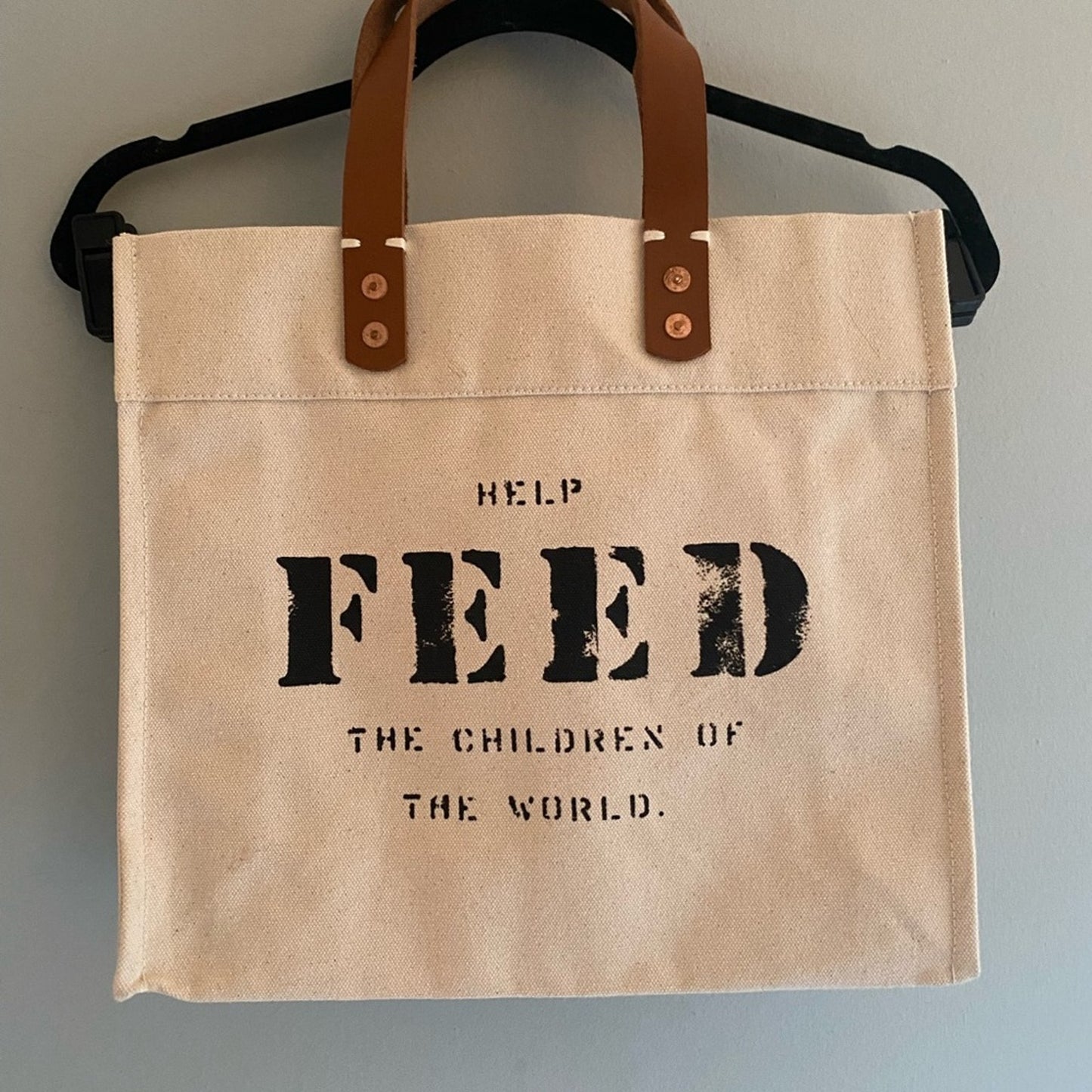 Never Worn Feed The Children Of The World Bag